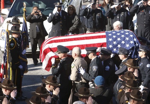 Leah Hogsten | The Salt Lake Tribune  
Members of the Ogden Police Department carry the casket of Ogden police Officer Jared Francom. Joined by law enforcement officers statewide, the family and friends of slain Ogden police Officer Jared Francom said farewell during Wednesday, January 11, 2012 funeral services.