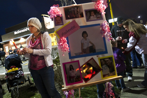 Chris Detrick  |  The Salt Lake Tribune
Along with community members, friends and family members, Kendra Gallegos attends a candlelight vigil for Ambrosia Amalathithada at State Street and Kensington Avenue Friday March 16, 2012.  Amalathithada was killed in the crosswalk on Wednesday afternoon on her way home from school with her mom.