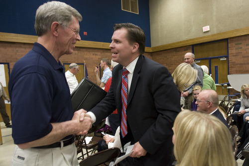 Kim Raff | The Salt Lake Tribune
Dan Liljenquist talks with Ray Westergard at the Republican caucuses at Mueller Park Jr. High in Bountiful on Thursday.