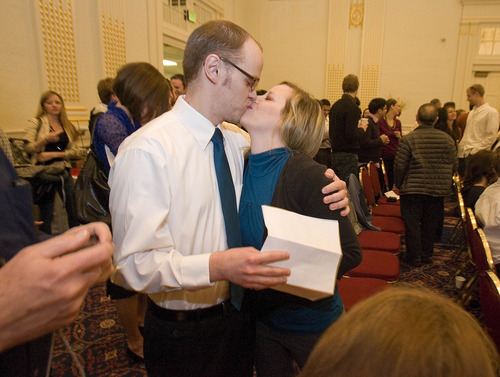 Paul Fraughton | The Salt Lake Tribune.
Cory Kogelschatz and his wife Alli  celebrate with a kiss  after reading Cory's  match letter  sending him to the Mayo Clinic for his residency. Match Day, where graduating medical students find out where they will do their residencies,  took place at Gardner Hall on the University of Utah campus on
Friday, March 16, 2012.