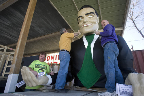 Paul Fraughton | The Salt Lake Tribune.
Following in the tradition of poking fun at the establishment, Matt Ivers, Vince Coley and Leonard Mascher, work on their float for the St. Patrick's Day Parade, an oversized effigy of Mitt Romney with dollar signs for eyes clutching giant 100 dollar bills. The float will be towed by a truck driven by  the  infamous family dog with Mitt himself in a cage in the truck's bed.
 Thursday, March 15, 2012