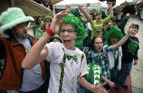 Scott Sommerdorf  |  Tribune file photo
Jeff Johnson of West Valley City, center, and Jennifer Rhode of Magna, below, right, enjoy the 2011 St. Patrick's Day Parade. This year's parade begins 10 a.m. Saturday at The Gateway.