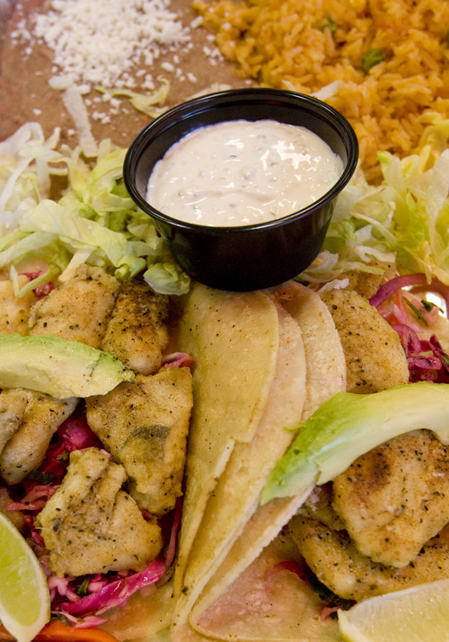 Leah Hogsten  |  The Salt Lake Tribune
Halibut tacos at Taste of Red Iguana in the City Creek food court. Taste of Red Iguana is one of eight Utah-based eateries that will compete for City Creek dining dollars, with more than a dozen national chains, including as The Cheesecake Factory and Texas de Brazil Churrascaria.