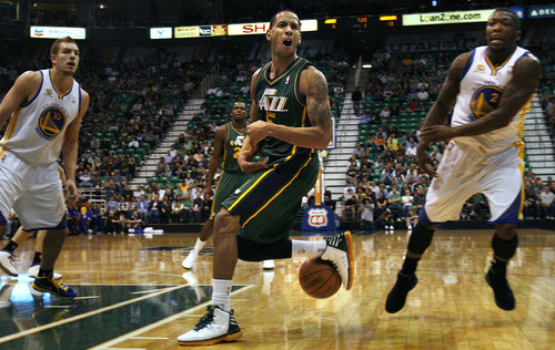 Scott Sommerdorf  |  The Salt Lake Tribune             
Jazz guard Devin Harris turns to complain about a traveling call as he was driving toward the paint. The Utah Jazz play the Golden State Warriors early i n the first period at Energy Solutions Arena, Saturday, March 17, 2012.