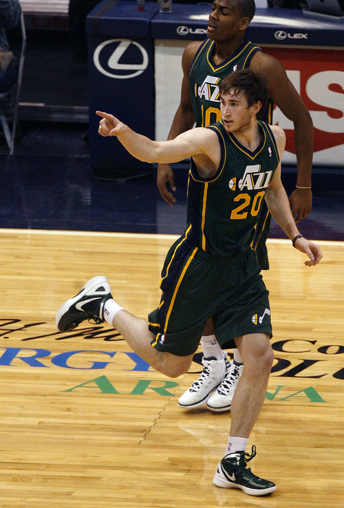 Scott Sommerdorf  |  The Salt Lake Tribune             
Gordon Hayward points back at team mate Paul Millsap after Millsap's assist on his jump shot during first half play. The Utah Jazz trailed the Golden State Warriors 51-46 at the half at Energy Solutions Arena, Saturday, March 17, 2012.