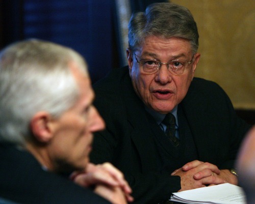 Tribune file photo
Above, Utahns for Ethical Government leader Kim Burningham (right) discusses the group's initiative with Lt. Gov. Greg Bell (left). The ballot measure is tied up in court over arguments about whether electronic signatures qualify as valid.