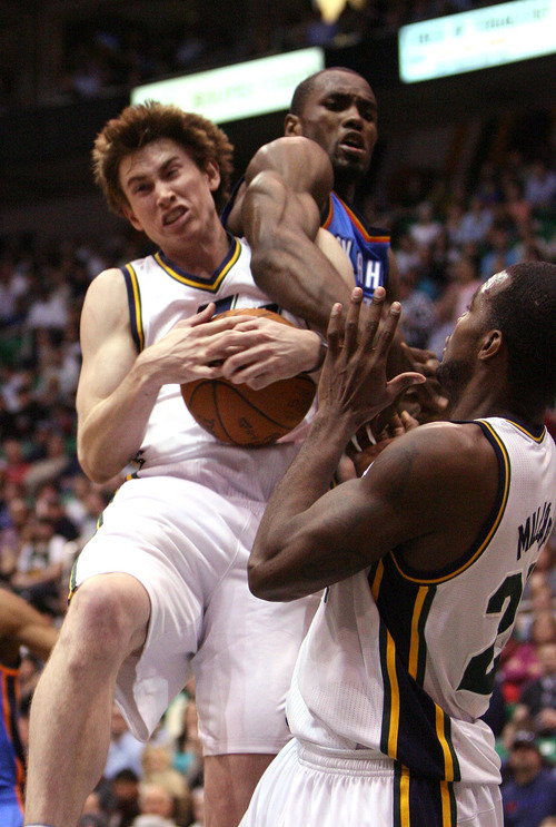Leah Hogsten  |  The Salt Lake Tribune
The Jazz's Gordon Hayward grabs the rebound beforeThunder's Serge Ibaka.  Utah Jazz lead 52-44 after the first half against Oklahoma City Thunder, Tuesday, March 20, 2012, at the Energy Solutions Arena in Salt Lake City, Utah .