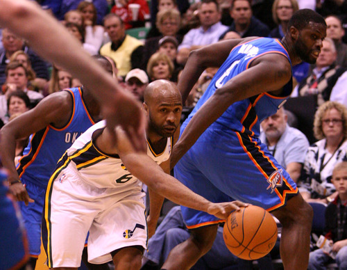 Leah Hogsten  |  The Salt Lake Tribune
The Jazz's Jamaal Tinsley catches his through-the-legs pass on the Thunder's Nazr Mohammed. Utah Jazz defeated Oklahoma City Thunder 97-90 Tuesday, March 20, 2012, at the Energy Solutions Arena in Salt Lake City, Utah .