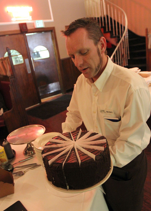 Francisco Kjolseth  |  The Salt Lake Tribune
Scott Sorensen prepares a slice of five-layer chocolate cake at Lamb's Grill Cafe, which has a new owner and chef. Many of the well-known dishes remain on the menu, including the lamb shank, braised for five hours at 300 degrees.