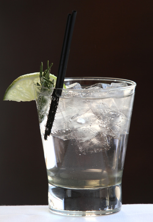 Rick Egan  | The Salt Lake Tribune 
Zy's Sapphire Rose cocktail is made with Bombay Sapphire Gin, rosemary-infused simple syrup, soda water, a rosemary sprig and lime slice for garnish.