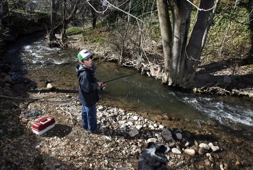 Francisco Kjolseth  |  The Salt Lake Tribune
Taylor Green, 10, who suffers from bi-polar dissorder, ADHD and anxiety finds comfort in his latest obsession of fishing as he fishes one of his favorite holes in Sugarhouse where he has caught numerous trout. Taylor's mom Jamey resently organized a week of events on mental illness at his school of Uinta Elementary.