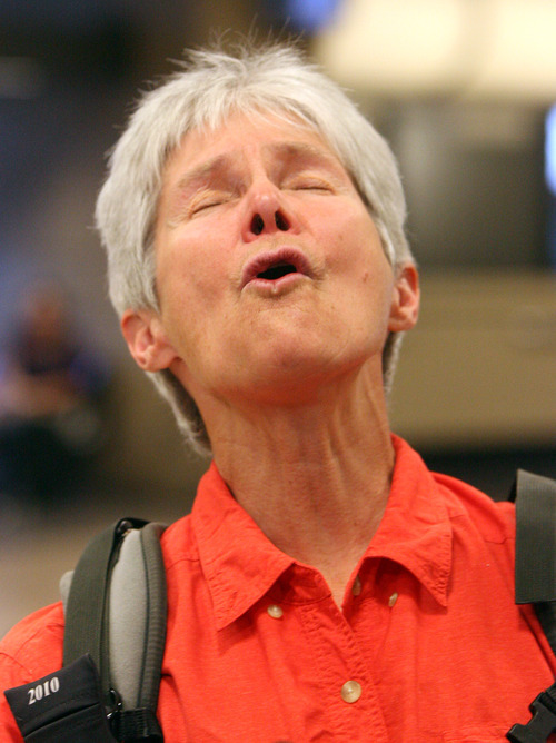 Leah Hogsten  |  The Salt Lake Tribune
Carol Masheter was greeted by co-workers and fellow Wasatch Mountain Club hikers Wednesday at the Salt Lake International Airport  in Salt Lake City. On March 17, Salt Lake City resident Carol Masheter, 65, reached the summit of Mount Kosciuszko in Australia, making her the oldest woman in the world to have reached the summit of the highest mountains on each of the world's seven continents.