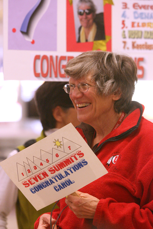 Leah Hogsten  |  The Salt Lake Tribune
Carol Masheter was greeted by co-workers and fellow Wasatch Mountain Club hiker Cheryl Soshnik with congratulatory signs at Salt Lake City International Airport on Wednesday. On Saturday, the Salt Lake City resident, 65, reached the summit of Mount Kosciuszko in Australia, making her the oldest woman in the world to have reached the summit of the highest mountains on each of the world's seven continents.