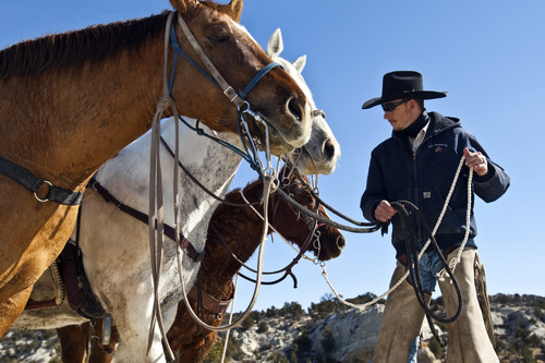 Chris Detrick  |  The Salt Lake Tribune
Cowboy Hoot Hatch, of Panguitch, rides to Rock Springs Point along the west edge of the Grand Staircase-Escalante National Monument on Saturday, Feb. 18, 2012.