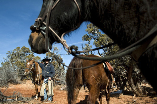 Chris Detrick  |  The Salt Lake Tribune
Cowboy Hoot Hatch, of Panguitch, horseback rides to Rock Springs Point along the west edge of the Grand Staircase-Escalante National Monument on Saturday, Feb. 18, 2012.