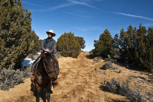 Chris Detrick  |  The Salt Lake Tribune
Cowboy Norm Neilson, from Tropic, rides to Rock Springs Point along the west edge of the Grand Staircase-Escalante National Monument on Saturday, Feb. 18, 2012.