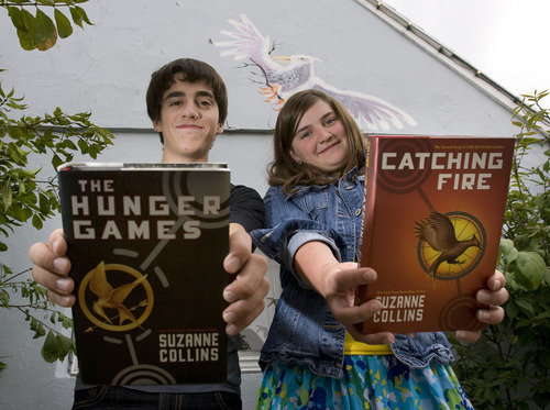 Steve Griffin  |  The Salt Lake Tribune

In this archive photo from August 2010, George and Emma Metos hold copies of their books in Suzanne Collins' 