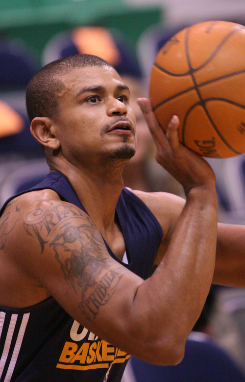 Leah Hogsten  |  The Salt Lake Tribune
Earl Watson of the Utah Jazz shoots during the pre-game warm-ups as the get ready to host Oklahoma City 3/20/12, in Salt Lake City, Utah at the Energy Solutions Arena.