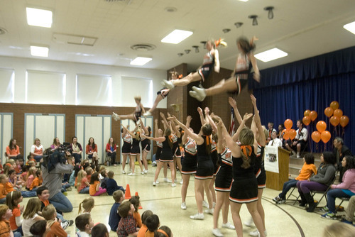 Paul Fraughton | The Salt Lake Tribune.
Murray High School cheerleaders  are flying high in the  multipurpose room at Liberty Elementary School. iThe cheerleaders and local officials joined the school's students at a rally for  