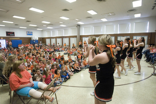 Paul Fraughton | The Salt Lake Tribune.
Murray High School cheerleaders perform  to a packed  multipurpose room at Liberty Elementary School. iThe cheerleaders and local officials joined the school's students at a rally for  