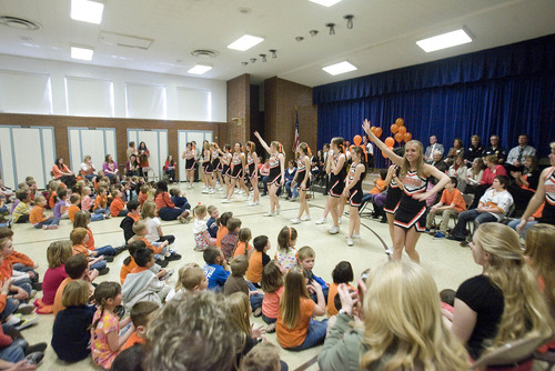 Paul Fraughton | The Salt Lake Tribune.
Murray High School cheerleaders perform  to a packed  multipurpose room at Liberty Elementary School. iThe cheerleaders and local officials joined the school's students at a rally for  