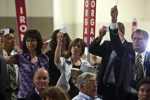 Photo by Chris Detrick | Tribune file photo
Keri Witte, center, and other delegates vote at the 2011 Utah Republican Convention. Most of those delegates have been replaced by newcomers elected in last week's GOP caucuses.