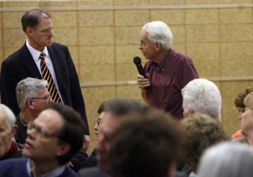 Kim Raff | The Salt Lake Tribune
(right) James Harris asks a question of MTC director Richard Heaton during a neighborhood meeting at Rock Canyon Elementary School in Provo to discuss building a new nine-story MTC building  on March 22, 2012.