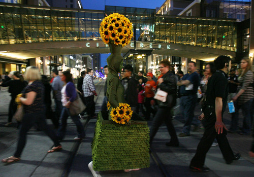 Kim Raff | The Salt Lake Tribune
A person dressed as a Human Topiary walks across Main Street during a street festival that closed Main Street to traffic in Salt Lake City, Utah on March 23, 2012.