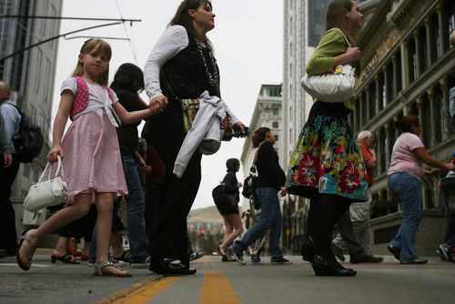 Kim Raff | The Salt Lake Tribune
People walk in Main Street in front of City Creek. The city closed Main Street to traffic for the street festival in Salt Lake City, Utah on March 23, 2012.