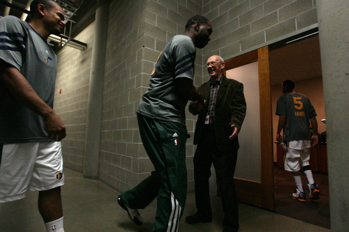 Leah Hogsten  |  The Salt Lake Tribune
Jazz player Al Jefferson greets Chaplain Jerry Lewis of The Point Christian Church as fellow player Earl Watson follows behind. 
Several Utah Jazz players attend a pregame chapel session on the arena floor-level of EnergySolutions Arena, Tuesday March 20, 2012, prior to their game against the Oklahoma City Thunder.