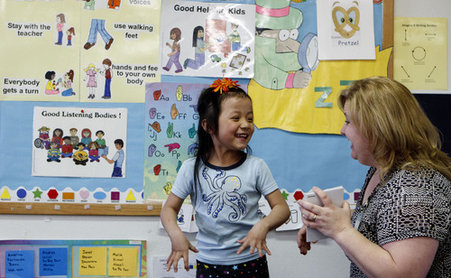 Trent Nelson  |  The Salt Lake Tribune
A girl imitates an animal while working with teacher Charlene Martin at the Early Learning Center preschool at the Granite School District.