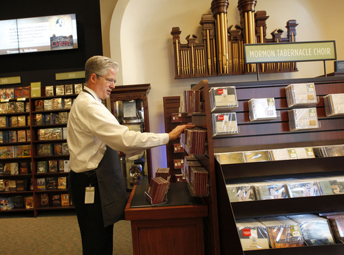 Al Hartmann  |  The Salt Lake Tribune
Jeff Clark, vice president for Deseret Book in the City Creek Center, works on a display of Mormon Tabernacle Choir CDs at the store Tuesday. Rather than the 7,000 to 8,000 people who typically come through his doors during LDS General Conference, his staff is gearing up for crowds that could easily top that because of the novelty of the City Creek Center.