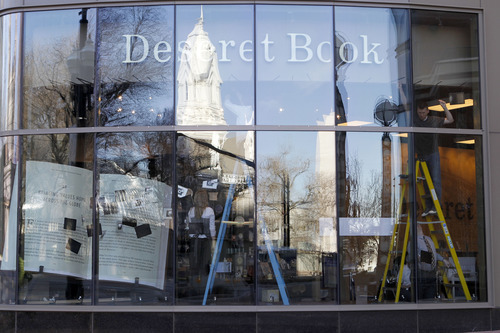 Al Hartmann  |  The Salt Lake Tribune
Staffers at Deseret Book in the City Creek Center work on their front-window display on Tuesday in preparation for LDS General Conference. Mobile registers will be added, and the regular sales staff of 14 to 15 will beef up with 60 additional workers from other Deseret Book locations along the Wasatch Front.
