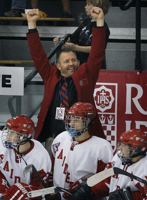 Scott Sommerdorf  |  The Salt Lake Tribune             
Regis Raiders acting head coach Terry Ott raises his arms in victory as the last few seconds count down in the third period of his team's championship win. The Regis Jesuit (Colo) Raiders won the 2012 USA High School Hockey Championship with a 4-3 win over the Waterloo (Iowa) Warriors, Sunday, March 25, 2012.
