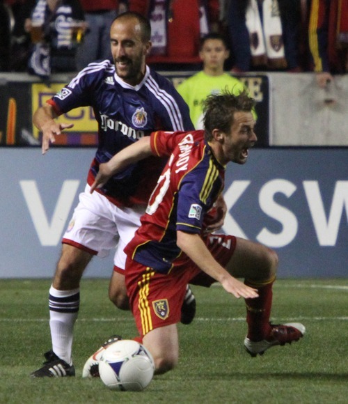 Rick Egan  | The Salt Lake Tribune 

Real Salt Lake's Nat Borchers (6) is knocked down by  Peter Vagenas, Chivas USA, in MLS soccer action in Sandy, Saturday, March 24, 2012.