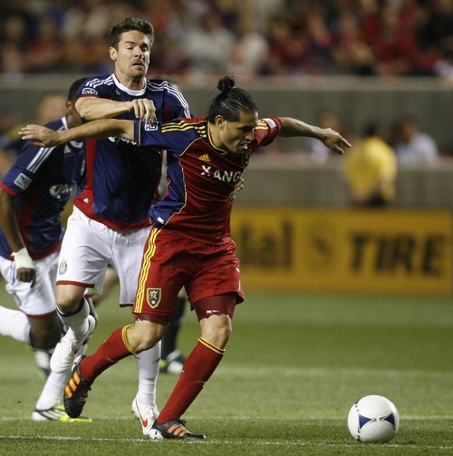 Rick Egan  | The Salt Lake Tribune 

Real Salt Lake's Fabian Espindola (7)  goes for the ball, as Heath Pearce defends for Chivas USA, in MLS soccer action in Sandy, Saturday, March 24, 2012.