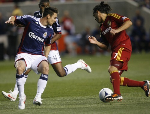 Rick Egan  | The Salt Lake Tribune 

Real Salt Lake's Fabian Espindola (7)  troes to get by Chiva's USA's  Heath Pearce, in MLS soccer action in Sandy, Saturday, March 24, 2012.