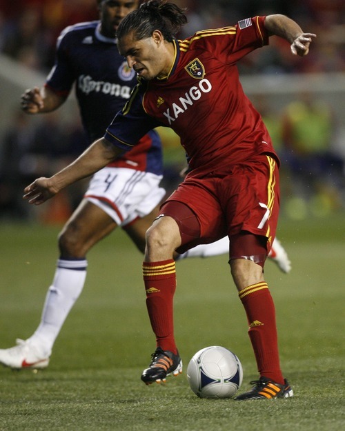 Rick Egan  | The Salt Lake Tribune 

Real Salt Lake's Fabian Espindola (7) contols the ball, as Rauwshan McKenzie defends for Chivas USA, in MLS soccer action in Sandy, Saturday, March 24, 2012.