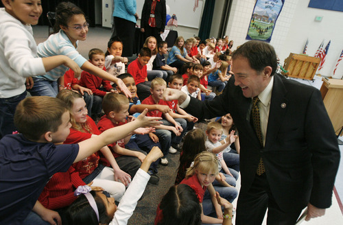 Francisco Kjolseth  |  The Salt Lake Tribune
Governor Gary R. Herbert gets a few fist bumps and hand shakes from third-graders at Falcon Ridge Elementary in West Jordan following a flag ceremony where the governor signed three education-related bills on Tuesday, March 27, 2012.