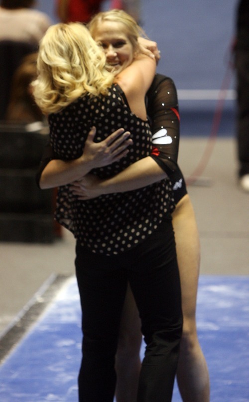 Kim Raff | The Salt Lake Tribune
University of Utah gymnast Kyndal Robarts gets a hug from her coach Megan Marsden after her performance on the beam during the Pac 12 Gymnastics Championship at the Huntsman Center in Salt Lake City, Utah on March 24, 2012.