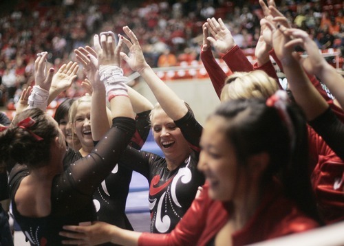 Kim Raff | The Salt Lake Tribune
University of Utah gymnast Stephanie McAllister is congratulated by her team for her performance on the uneven bars during the Pac 12 Gymnastics Championship at the Huntsman Center in Salt Lake City, Utah on March 24, 2012.