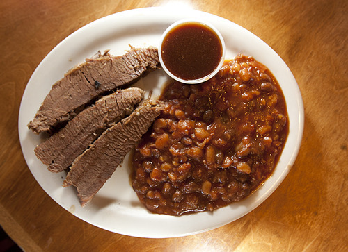 Leah Hogsten  |  The Salt Lake Tribune
Smedley Manor's beef brisket, with a choice of sauce and a side of baked beans.