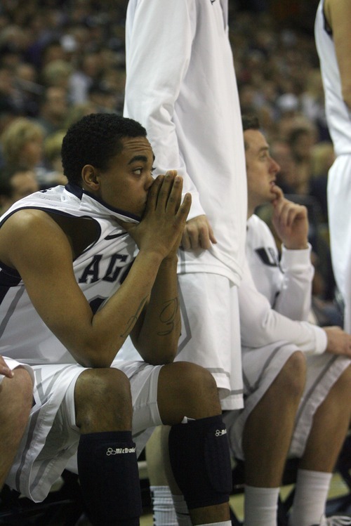 Kim Raff | The Salt Lake Tribune
Utah State University A.J. Farris sits with his head in his hands as his team closes the gap on Mercer during the second half of CIT Championship game at Utah State University in Logan, Utah on March 28, 2012.  Mercer went on to win the game 67-70.