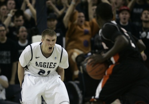 Kim Raff | The Salt Lake Tribune
Utah State University Morgan Grim screams to his team while on defense against Mercer during the CIT Championship game at Utah State University in Logan, Utah on March 28, 2012.  Mercer went on to win 70-67.