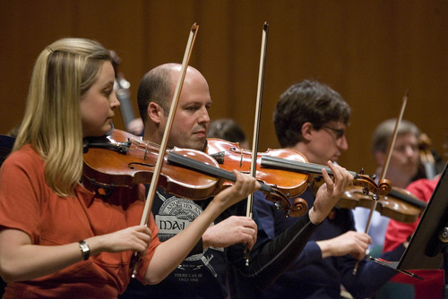 Paul Fraughton | The Salt Lake Tribune.
Amateur musician Jared Bracetti, right, sits next to Utah Symphony violinist Kathryn Eberle at the symphony's  first Pro Am concert where professional musicians and amateurs sit side by side playing music by  Beethoven.
 Thursday, March 29, 2012