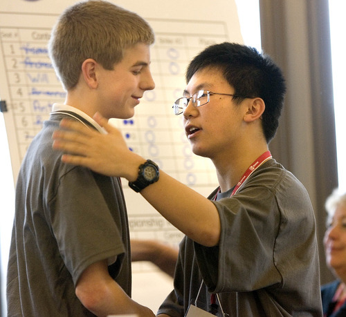 Paul Fraughton | The Salt Lake Tribune
Anthony Cheng, right, shakes hands with Will Hooper, who placed second in Utah's National Geographic Bee held Friday  at Thanksgiving Point in Lehi. Cheng, who did not miss a single question in the  final round, will represent the state at the nationals in Washington, D.C., in May.