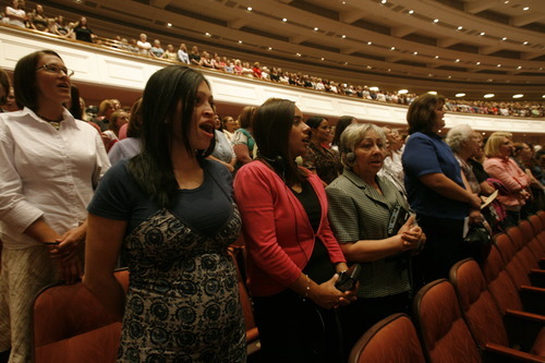 Rick Egan  |  Tribune file photo
Faithful LDS women sing along with the choir during the General Relief Society meeting at the Conference Center in Salt Lake City in 2009.