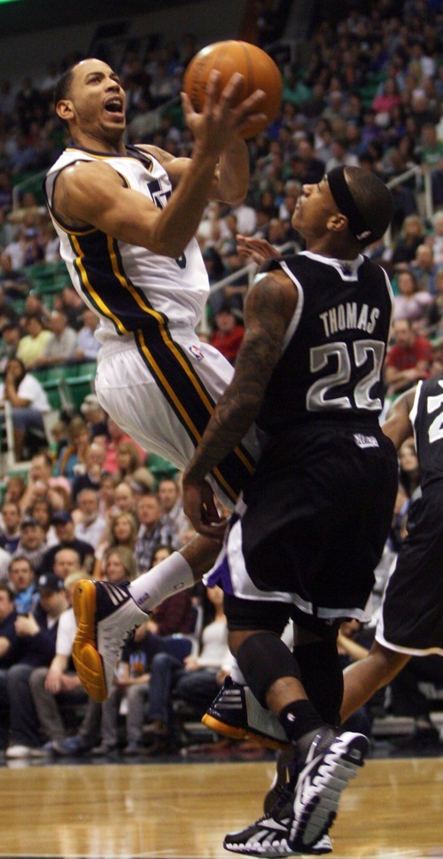 Kim Raff | The Salt Lake Tribune
Jazz player Devin Harris attempts a shot as Kings player Isaiah Thomas defends during at game at EnergySolutions Arena in Salt Lake City, Utah on March 30, 2012.