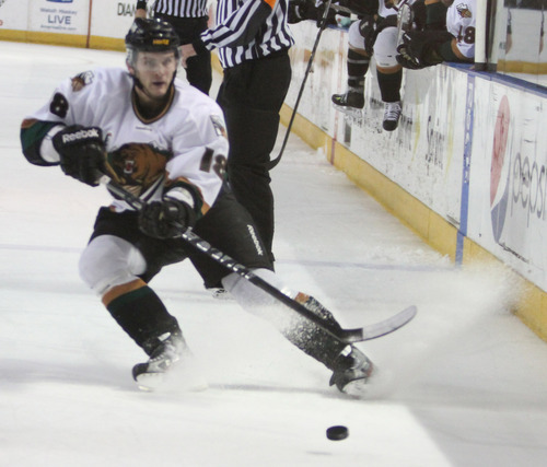 Rick Egan  | The Salt Lake Tribune 

Jeff LoVecchio (18) passes the puck for the Grizzlies, in ECHL action Grizzlies vs. The Las Vegas Wrangles, at the Maverick Center,  Monday, April 2, 2012.