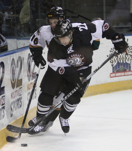 Rick Egan  | The Salt Lake Tribune 

Colin Vock (16)  goes for the puck for the  Grizzlies, along with Bretton Stamler (22) for the Wranglers, in ECHL action Grizzlies vs. The Las Vegas Wrangles, at the Maverick Center,  Monday, April 2, 2012.